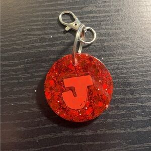 Red circle “J” keychain $10